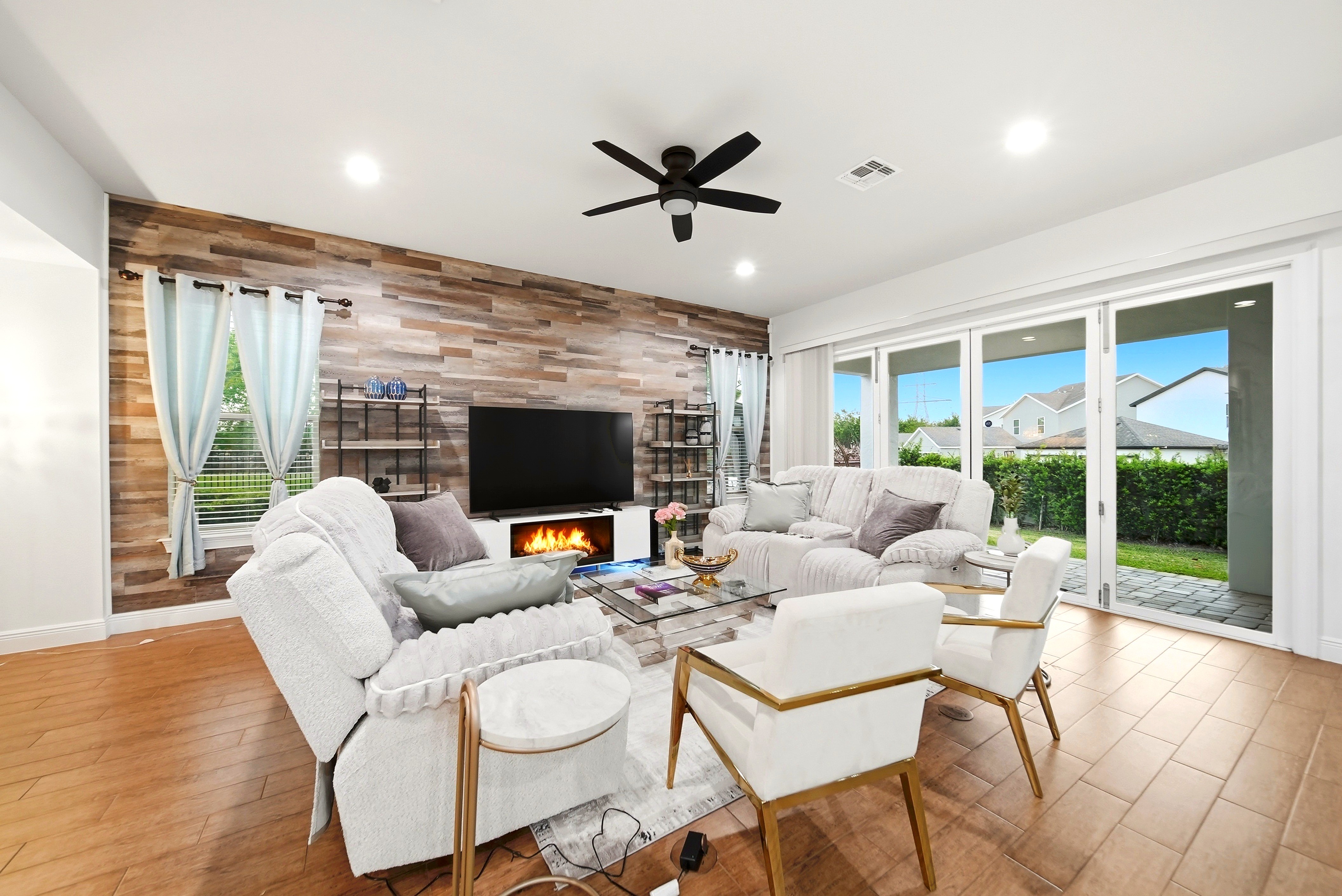 Living room with fireplace and TV