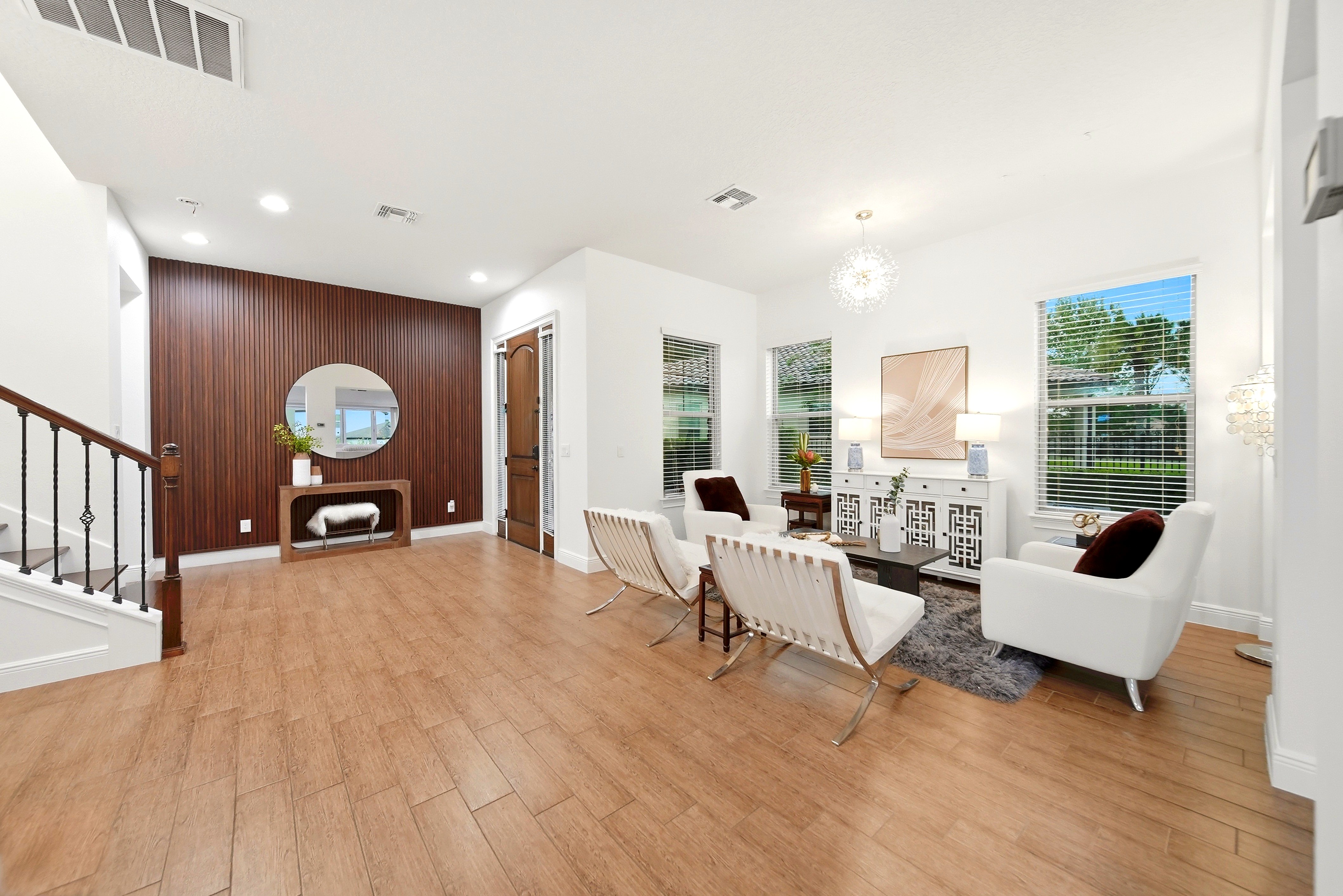Modern living room with white chairs