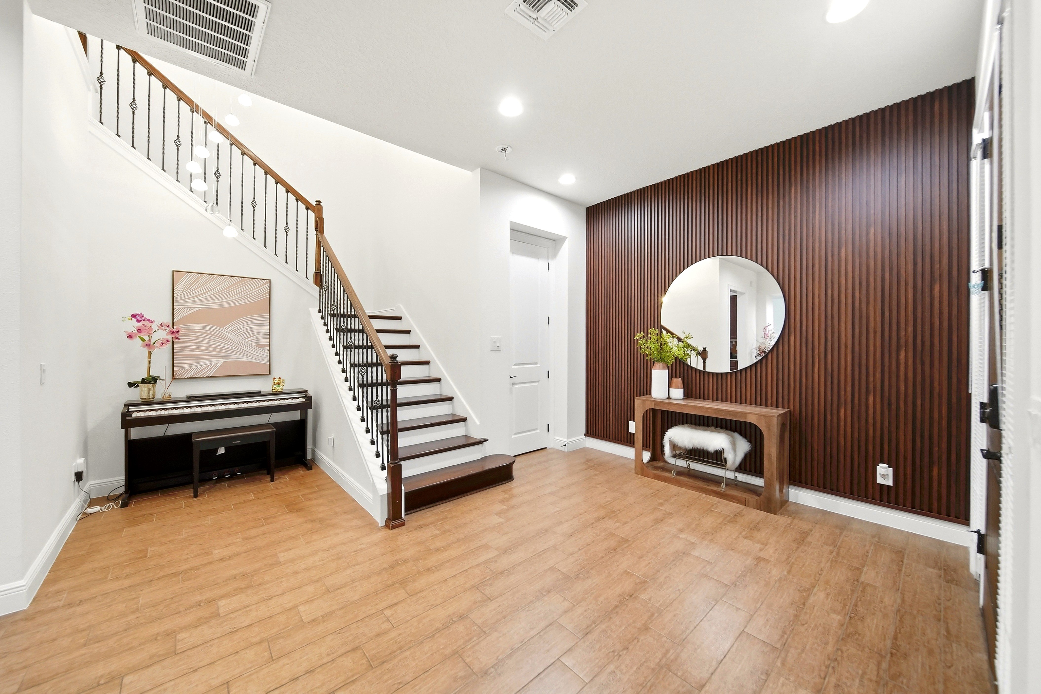 Entryway with staircase and piano