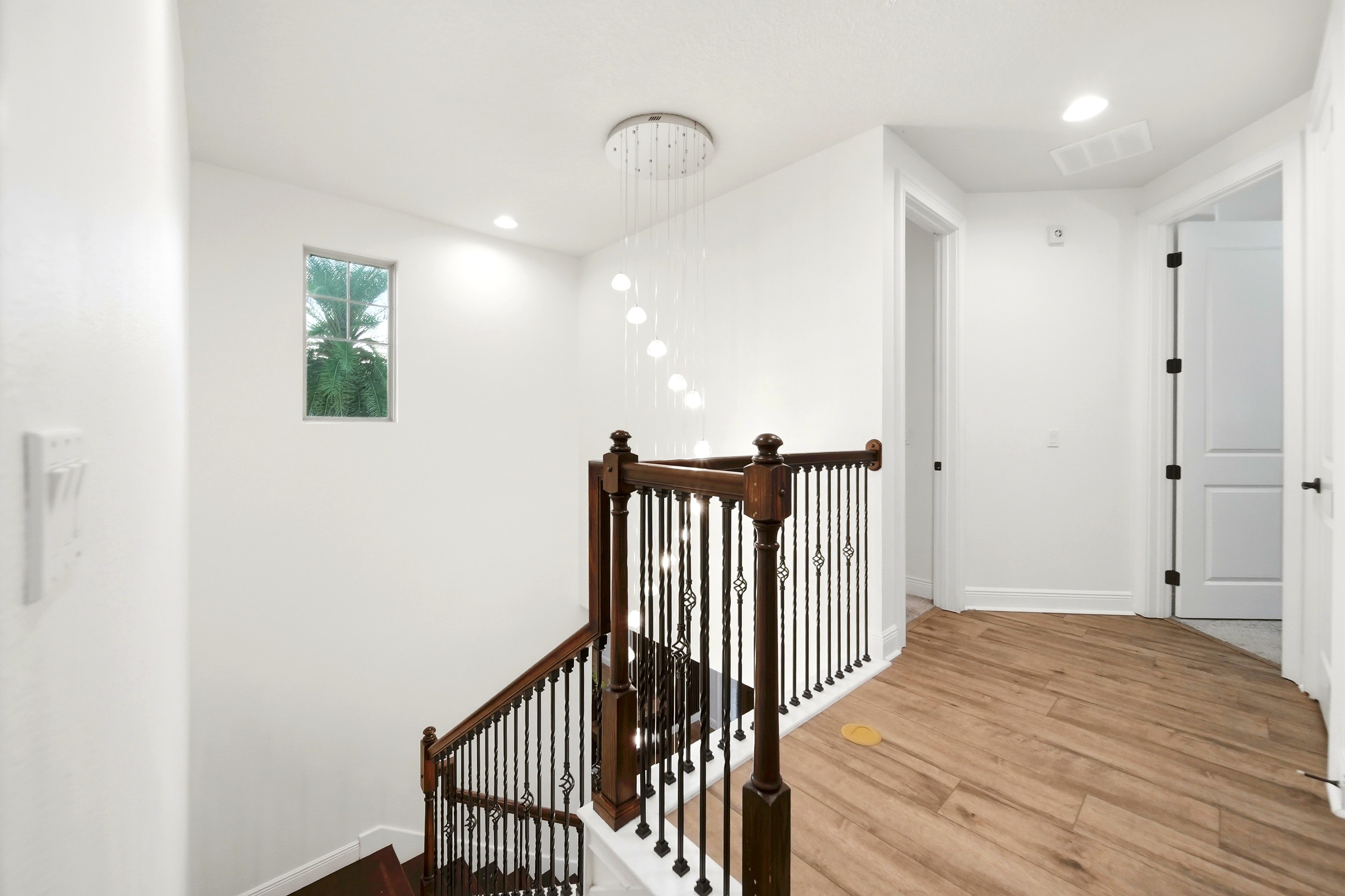 Staircase landing with wood floor