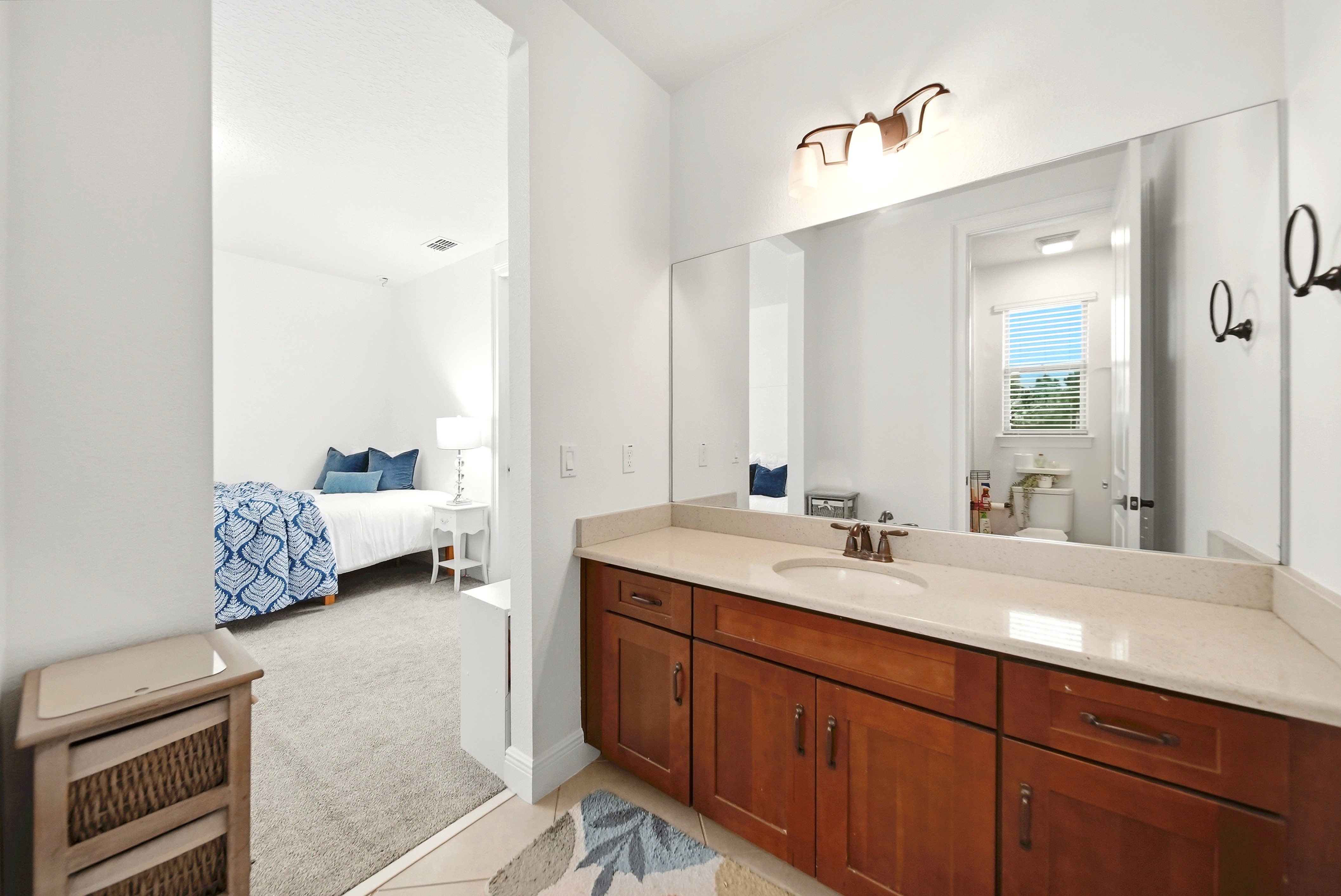 Bathroom vanity next to bedroom